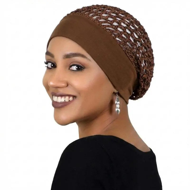 A woman wearing the coffee Pomence sleeping bonnet