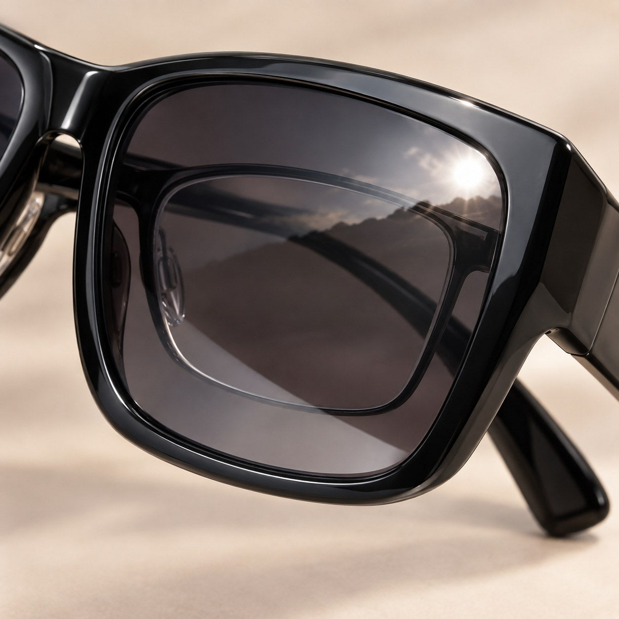 Macro of the polarized lens of the Pomence Fit-Over Sunglasses with a clear prescription lens visible beneath it