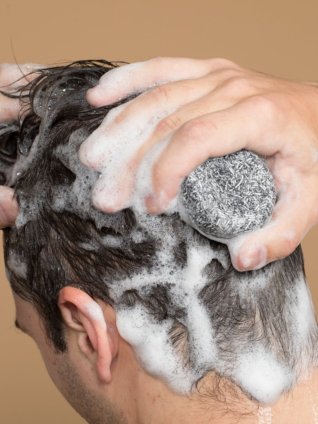 Lathering the Pomence Gray Hair Soap Bar into wet hair