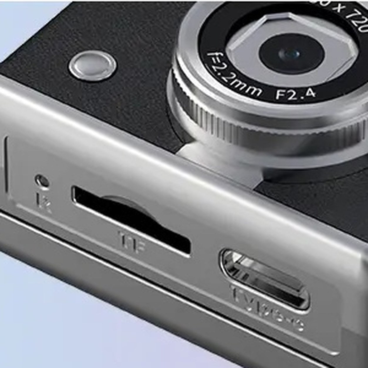 Close-up of the slot for the memory card and the USB-C port on the bottom of the Pomence Mini Keychain Camera