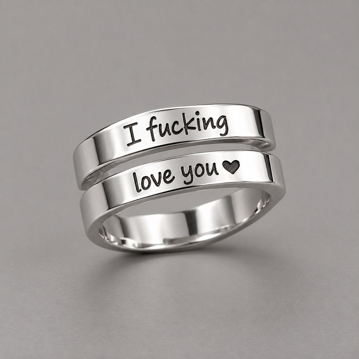 The Pomence I F♡cking Love You Ring alone on a grey ground