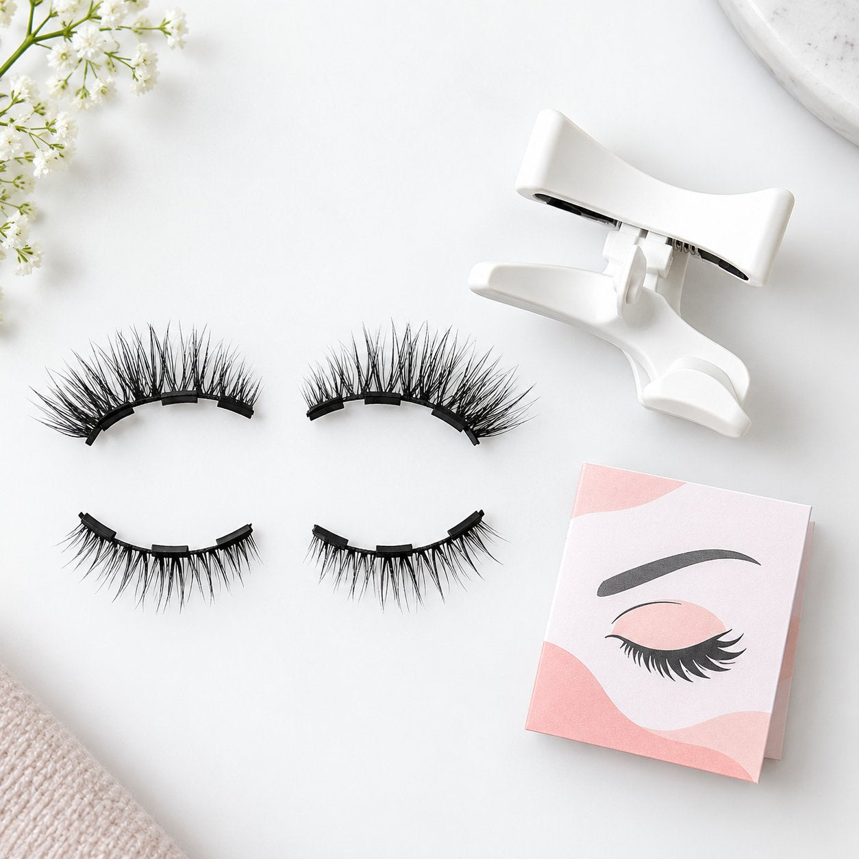 Pomence magnetic lash set laid out with the applicator and how-to guide
