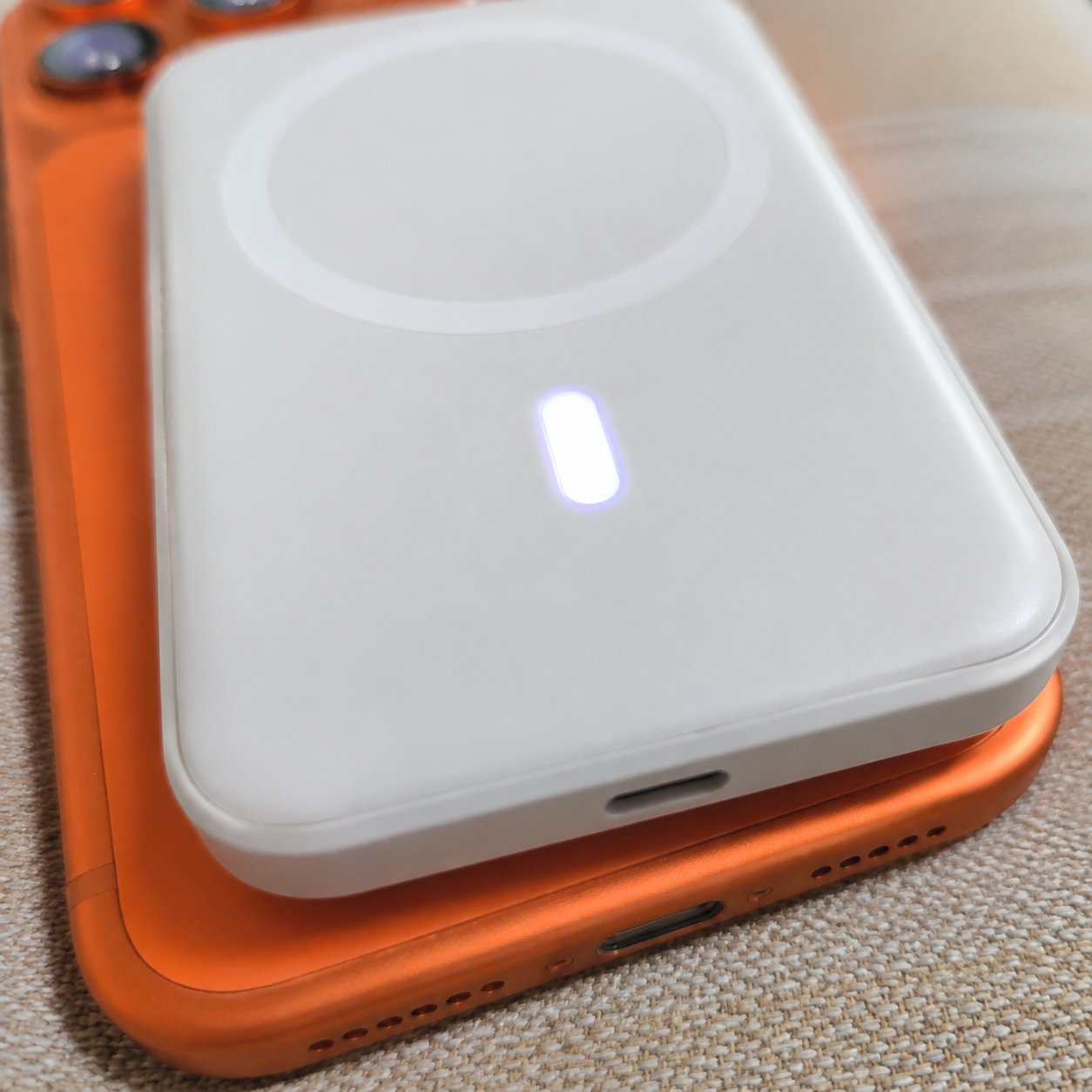 Indicator light glowing on the Pomence power bank while charging