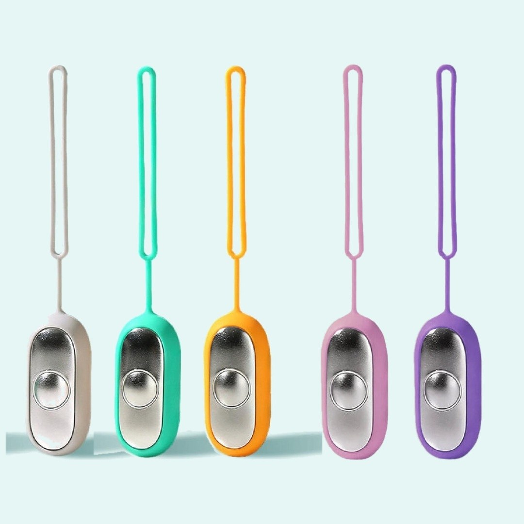All five Pomence Palm Calm Fidget colors together: Grey, Teal, Orange, Pink and Purple