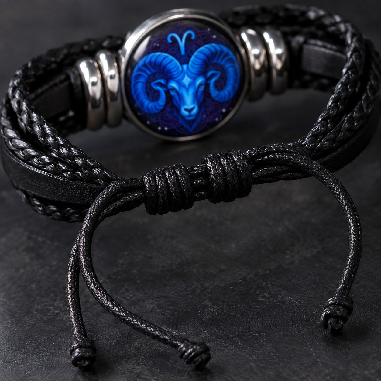 The black waxed sliding-knot closure on the Pomence Zodiac Leather Bracelet