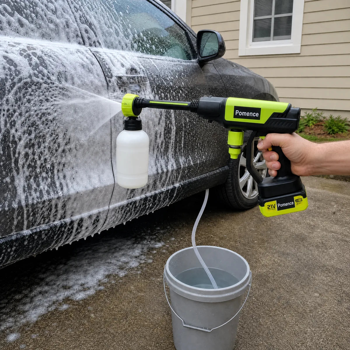 Amelia C. using the Pomence foam attachment on a car