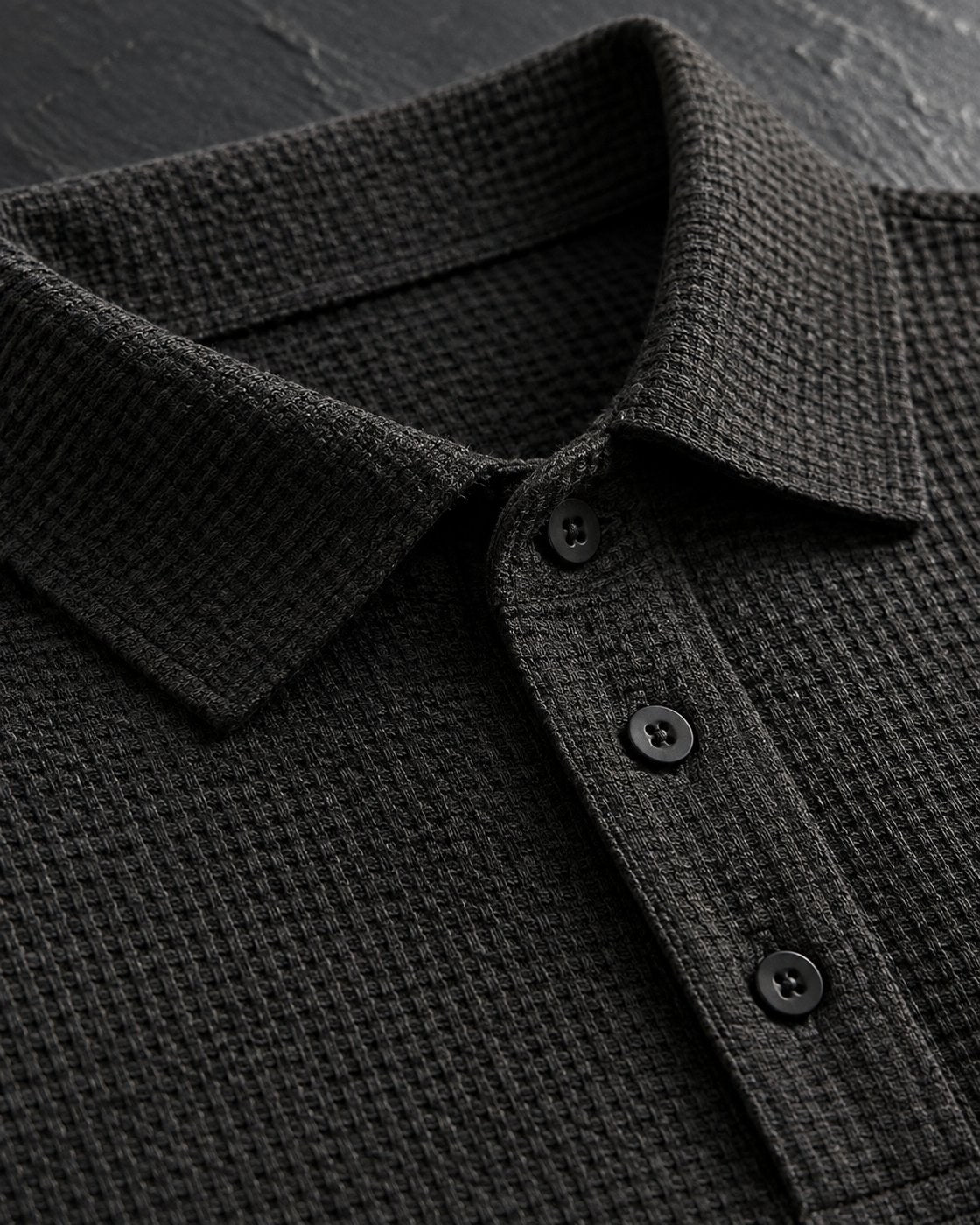 Pomence™ Textured Stretch Polo. Pomence Textured Stretch Polo, collar and three-button placket close-up, Espresso Black