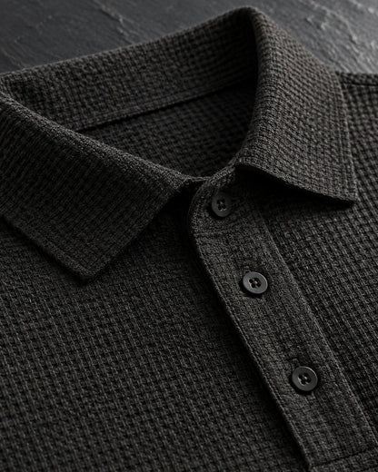 Pomence™ Textured Stretch Polo. Pomence Textured Stretch Polo, collar and three-button placket close-up, Espresso Black