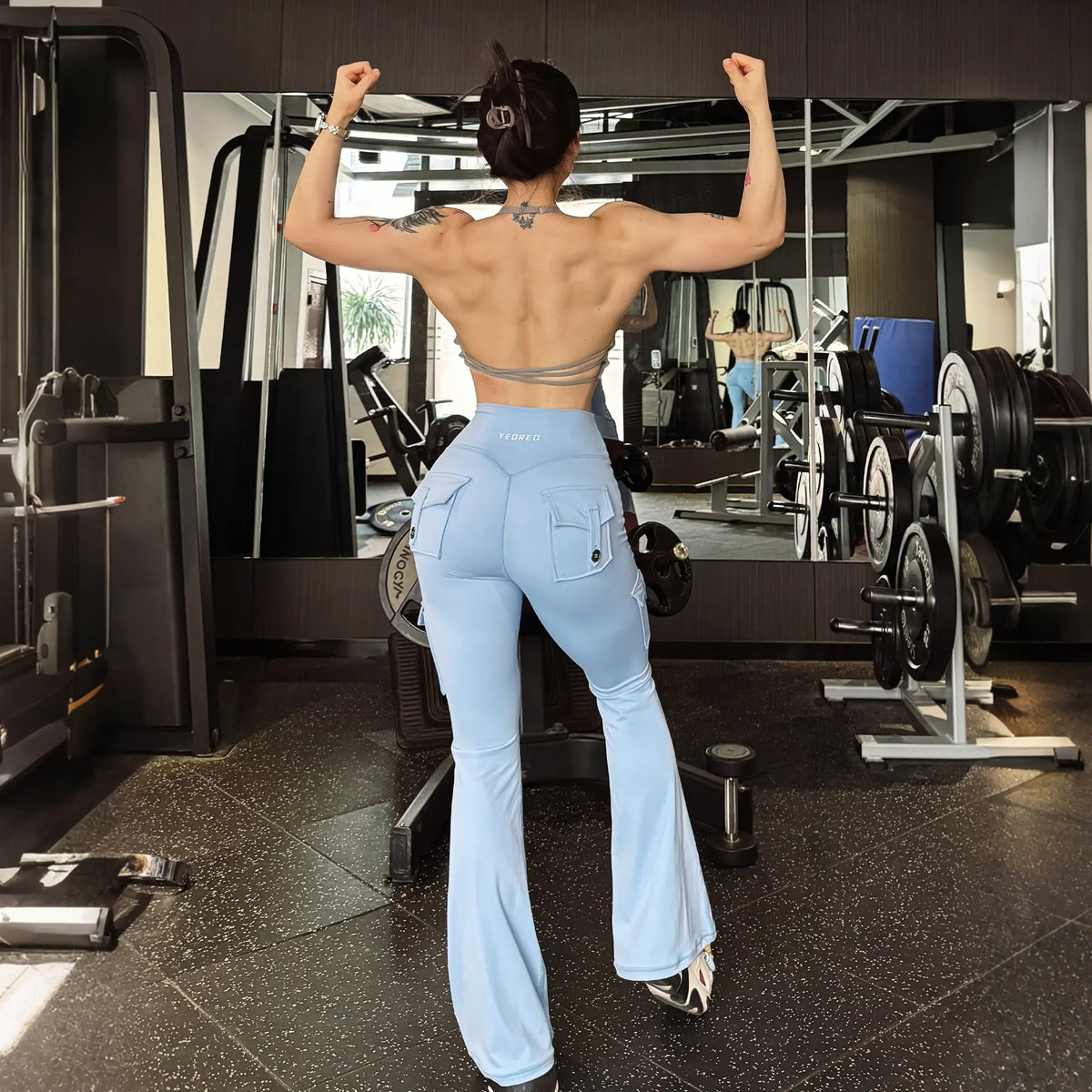 Flare cargo pocket leggings, back view at the gym