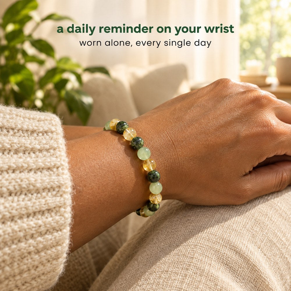 The Pomence Three Stone Abundance Bracelet worn on a woman's wrist at home in soft window light