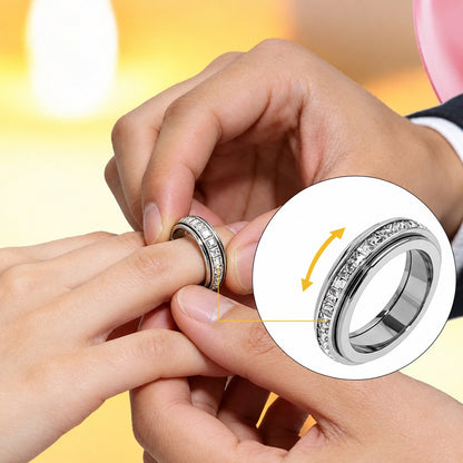 Pomence™ Anxiety Spinner Ring. Two hands spinning the outer band of the ring