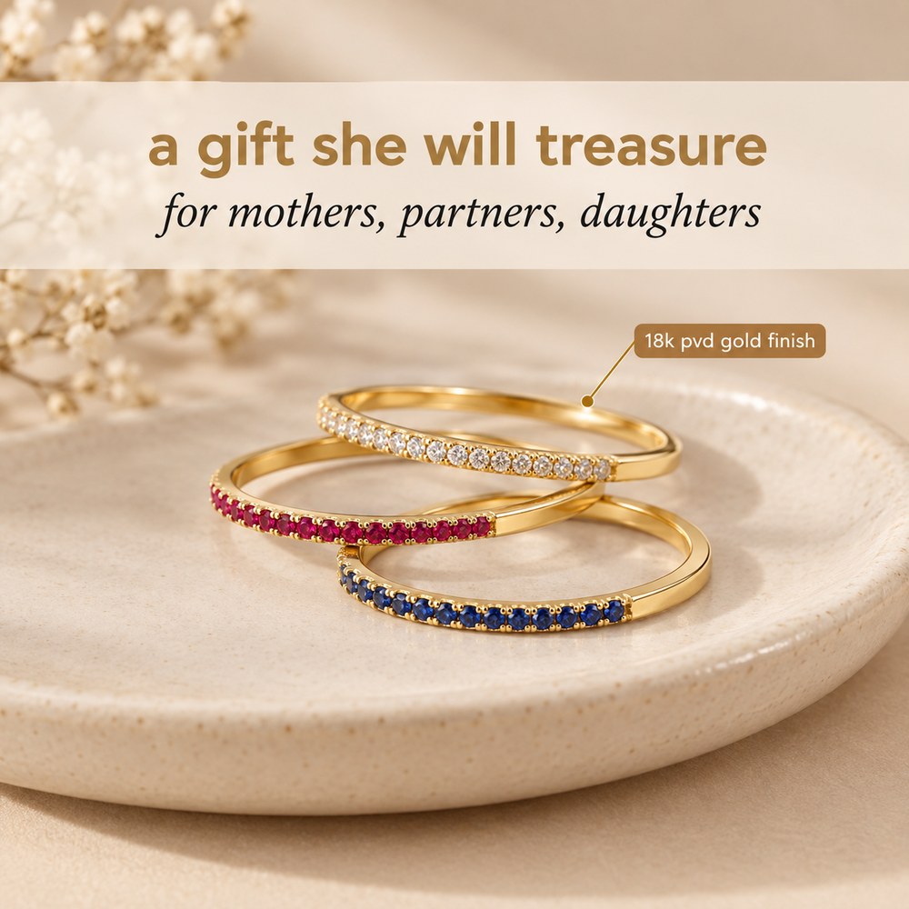 Three Pomence Birthstone Stacking Rings in different birth month colors staged together as a gift