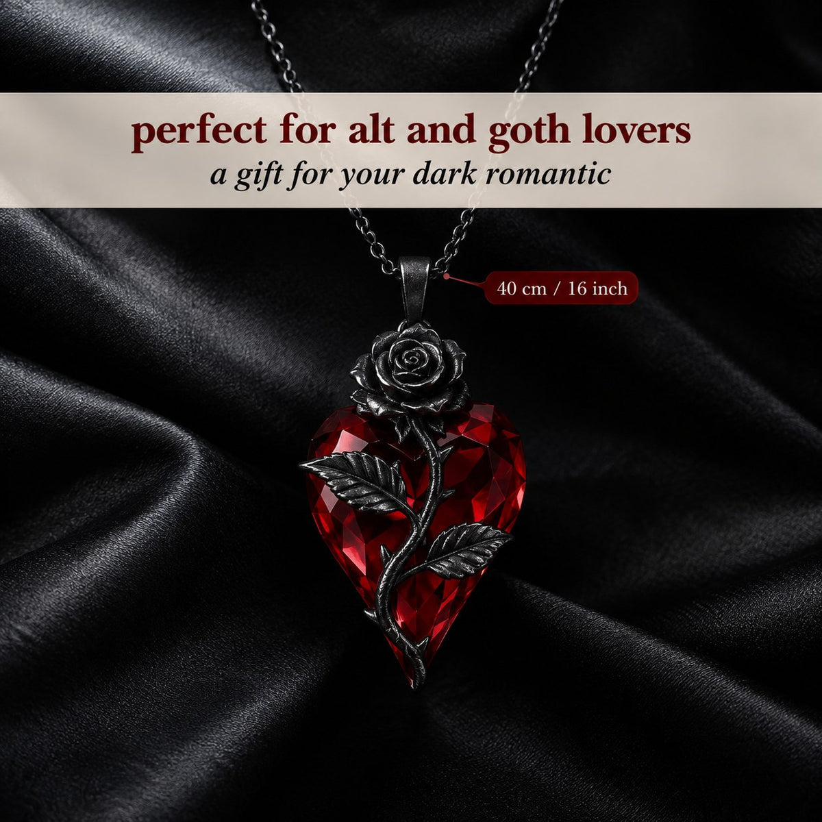 The Pomence Blood Rose Necklace staged on black satin with its 40 cm chain length called out
