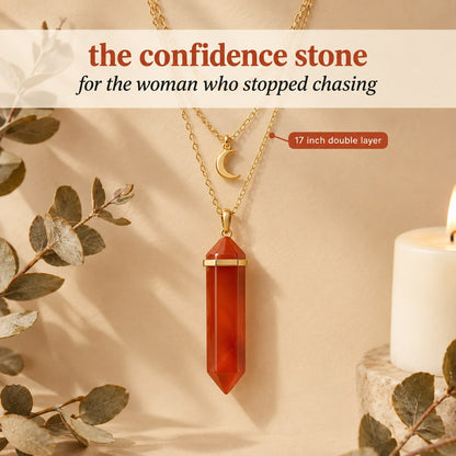 The gold Pomence Carnelian Attraction Necklace staged alone, its 17 inch cable chain and crescent moon charm in one frame
