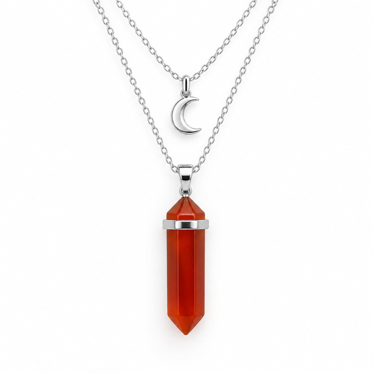 The Pomence Carnelian Attraction Necklace in the Silver colorway, showing the carnelian point in a bright silver bail with both silver chains and the crescent moon charm