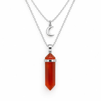 The Pomence Carnelian Attraction Necklace in the Silver colorway, showing the carnelian point in a bright silver bail with both silver chains and the crescent moon charm