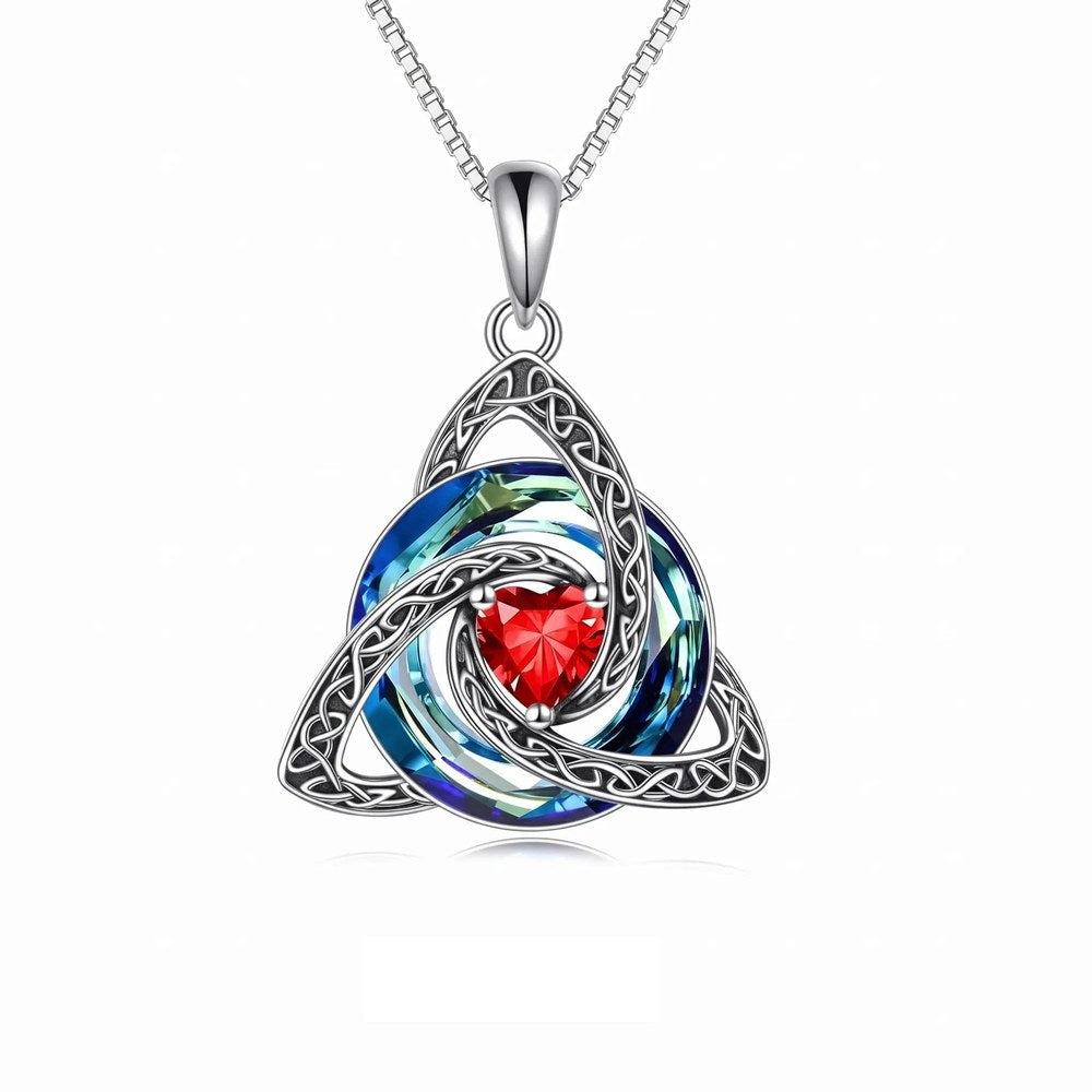 The Pomence Birthstone Celtic Knot Necklace pendant alone on a clean pale ground