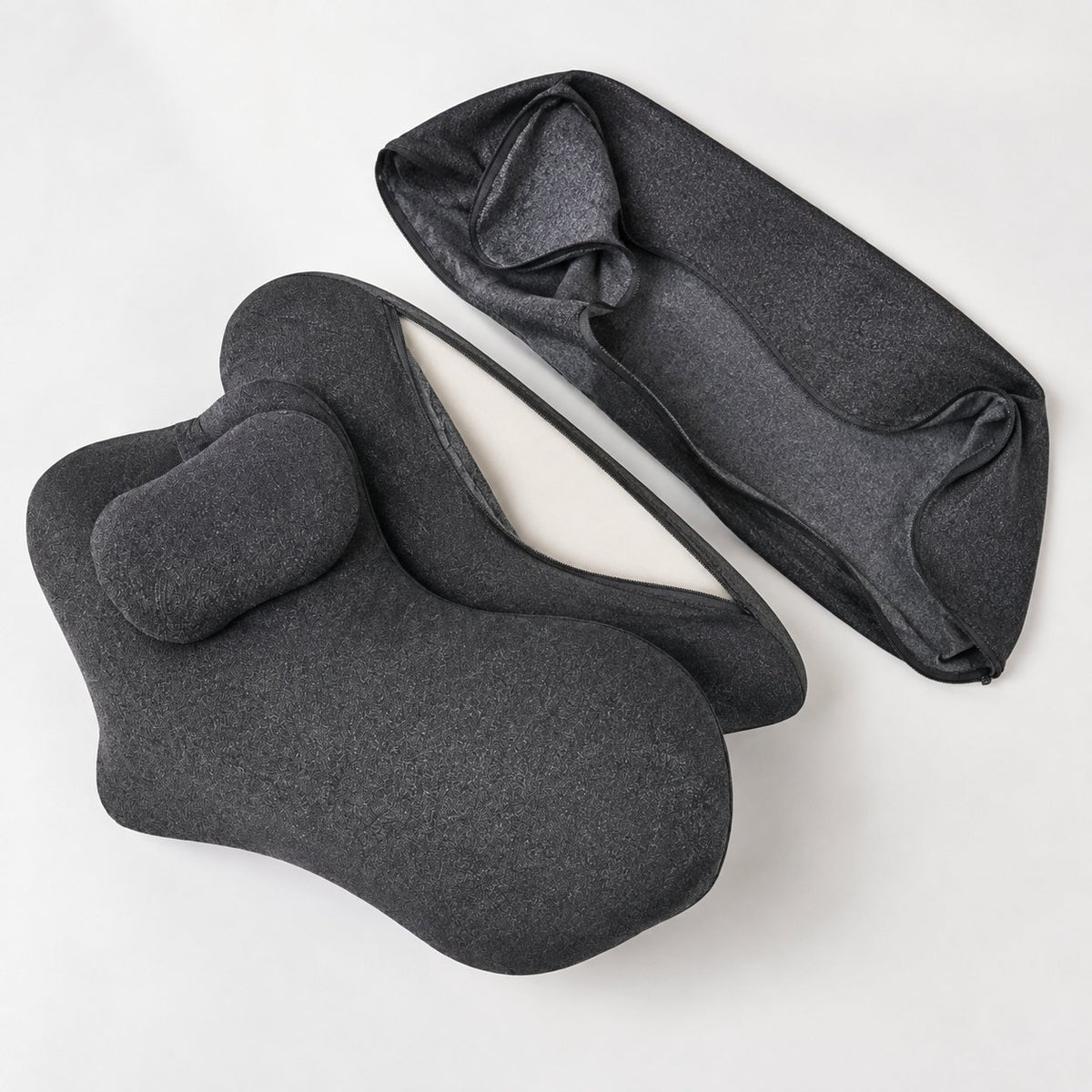Removable cover partly unzipped on the Pomence Couples Comfort Pillow, showing the foam core