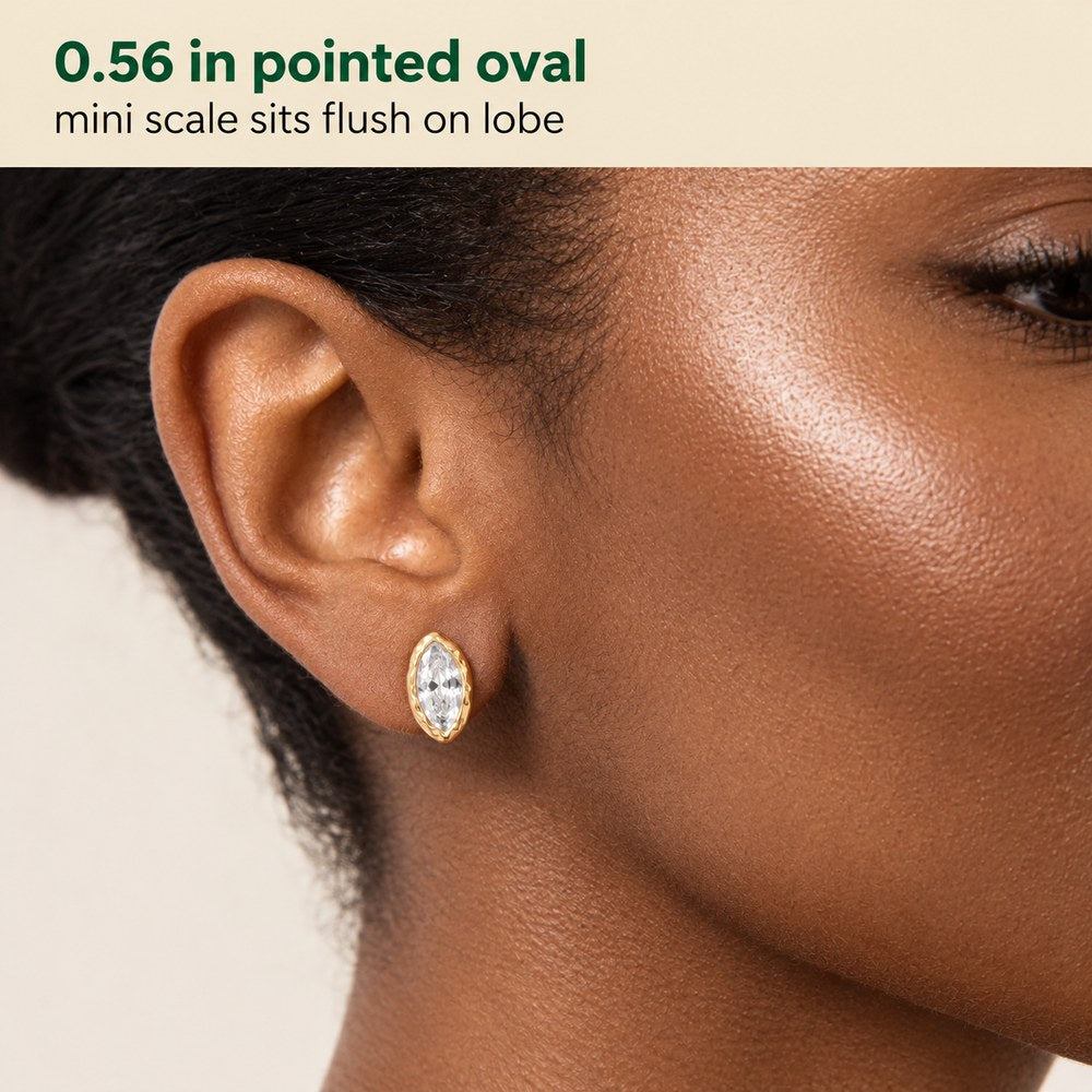 Macro of the marquise cut stone and hammered gold rim on the Pomence Crystal Mini Stud Earrings, 0.56 inches long