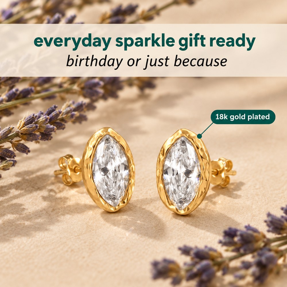 The pair of Pomence Crystal Mini Stud Earrings shown with dried lavender for everyday wear