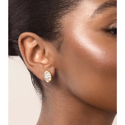 The Pomence Crystal Mini Stud Earrings in clear crystal, worn on the ear