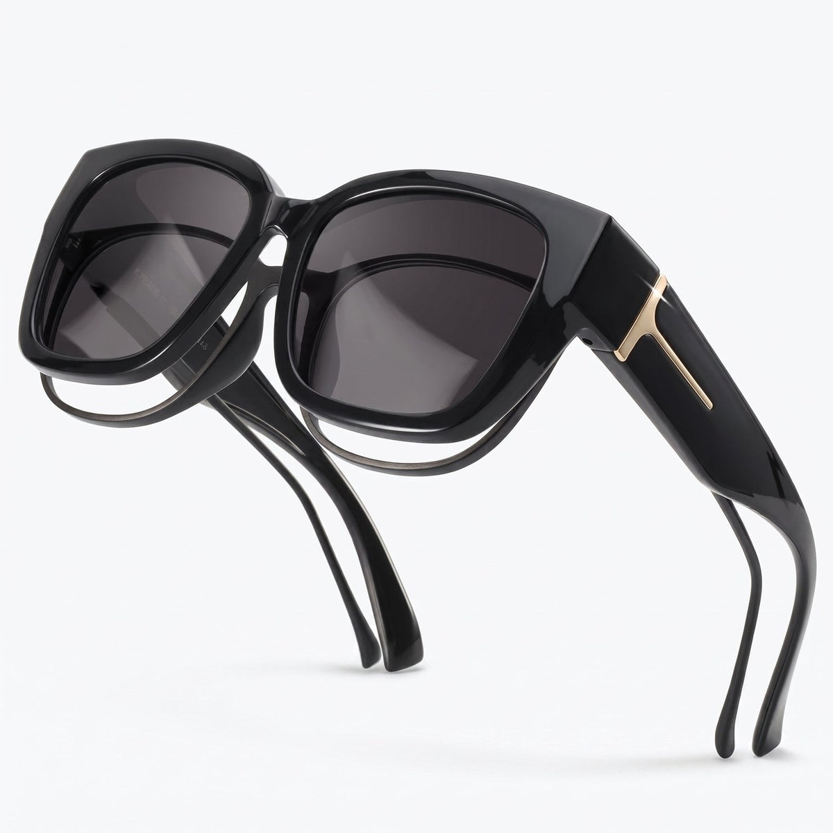 Pomence Fit-Over Sunglasses in Midnight, three-quarter packshot showing the deep square front and the wraparound side