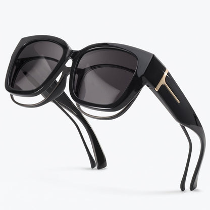 Pomence Fit-Over Sunglasses in Midnight, three-quarter packshot showing the deep square front and the wraparound side