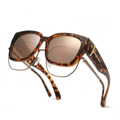 Pomence Fit-Over Sunglasses in the Havana (Tortoise Mirrored) colorway, an oversized square frame built to sit over prescription glasses