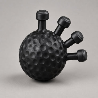 The Pomence Forearm Grip Trainer Ball alone: a palm sized matte black dimpled ball with five short capped pegs fanned out of one side