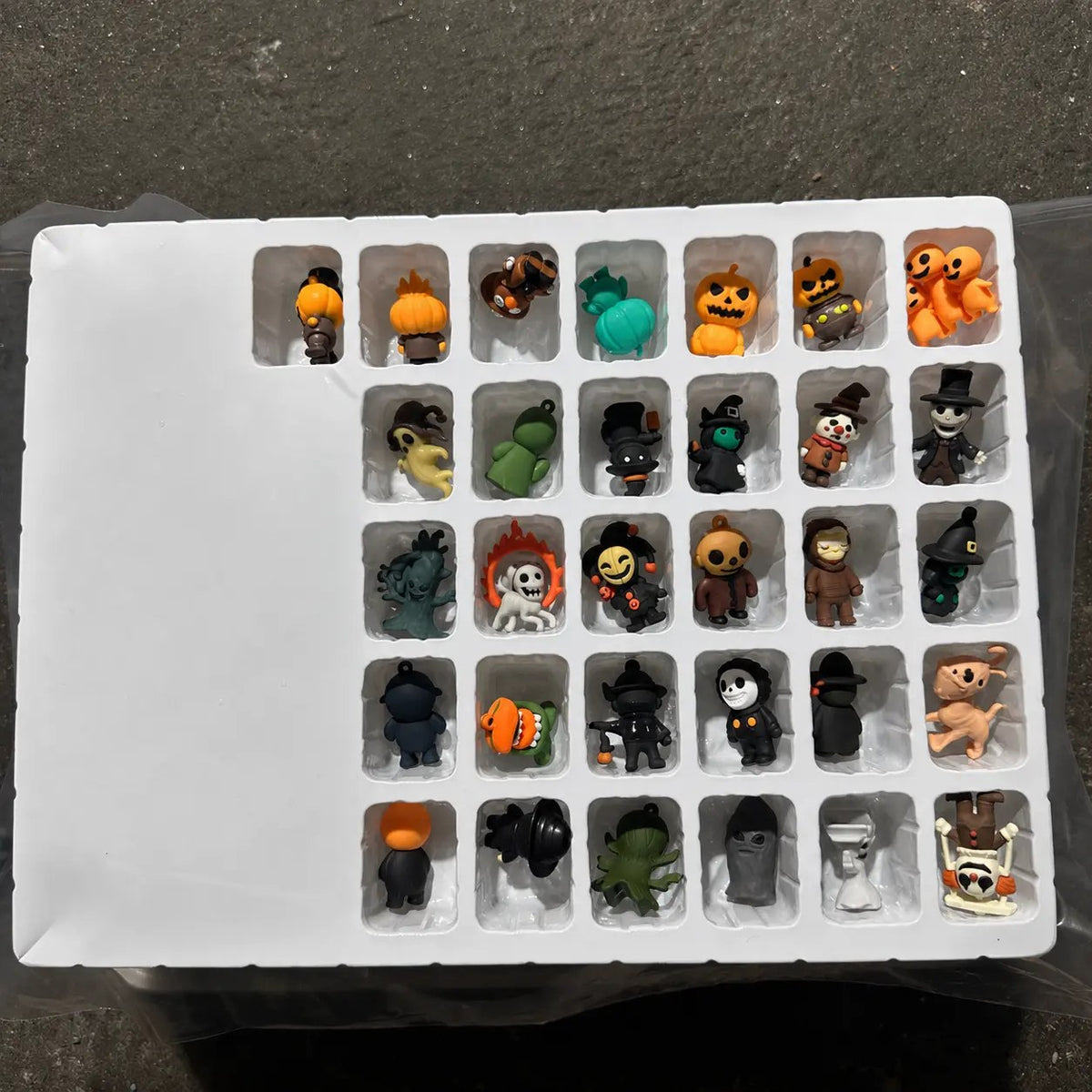 Individual scary doll minifigures and hanging charms from the blind bag set
