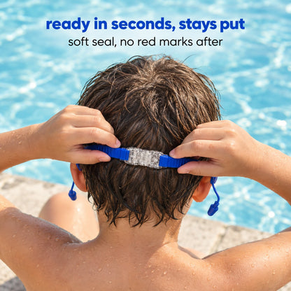 Seen from behind at the pool edge, two hands clicking the Pomence Kids Swim Goggles clasp shut at the back of the head