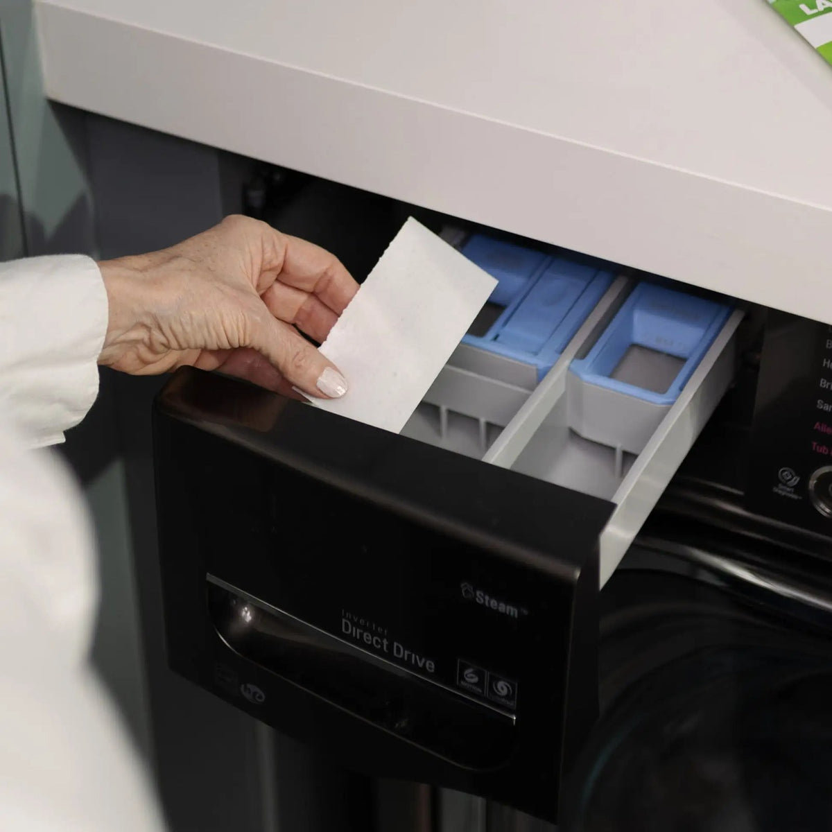 Placing a Pomence Laundry Detergent Sheet into a washing machine's detergent drawer