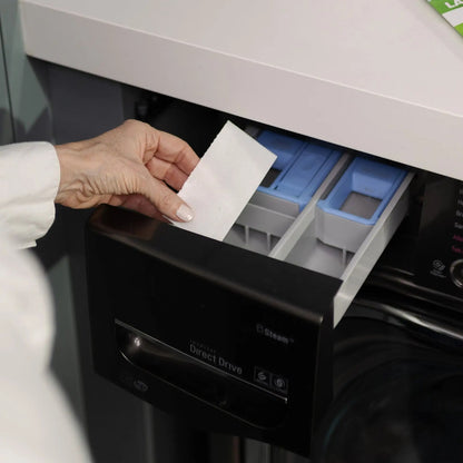 Placing a Pomence Laundry Detergent Sheet into a washing machine's detergent drawer