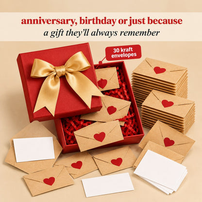 The Pomence Love Notes Gift Box staged as a gift with 30 kraft envelopes and blank notes around it
