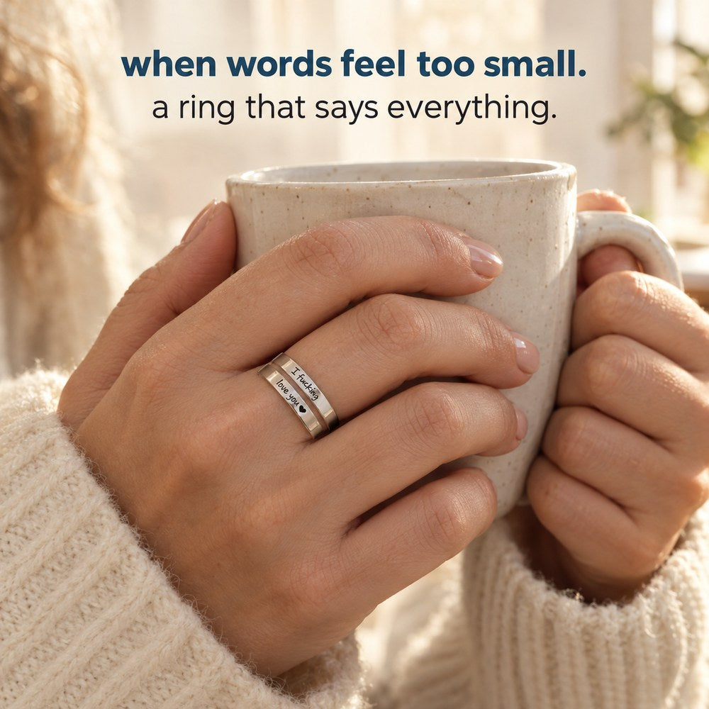An adult woman wearing the Pomence I F♡cking Love You Ring at home, hands and wrists in frame