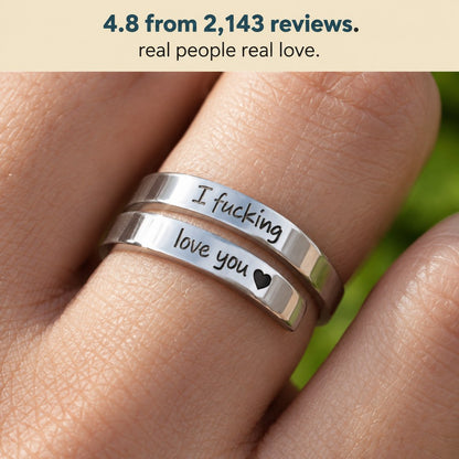 Macro of the Pomence I F♡cking Love You Ring worn on a finger with both engraved lines legible