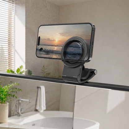 Pomence™ Magnetic Car Phone Mount. Clipped onto a bathroom mirror edge holding a phone, multi-scene use