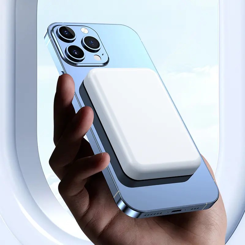 Pomence™ Magnetic Wireless Power Bank. Pomence Magnetic Wireless Power Bank, White, in use while traveling