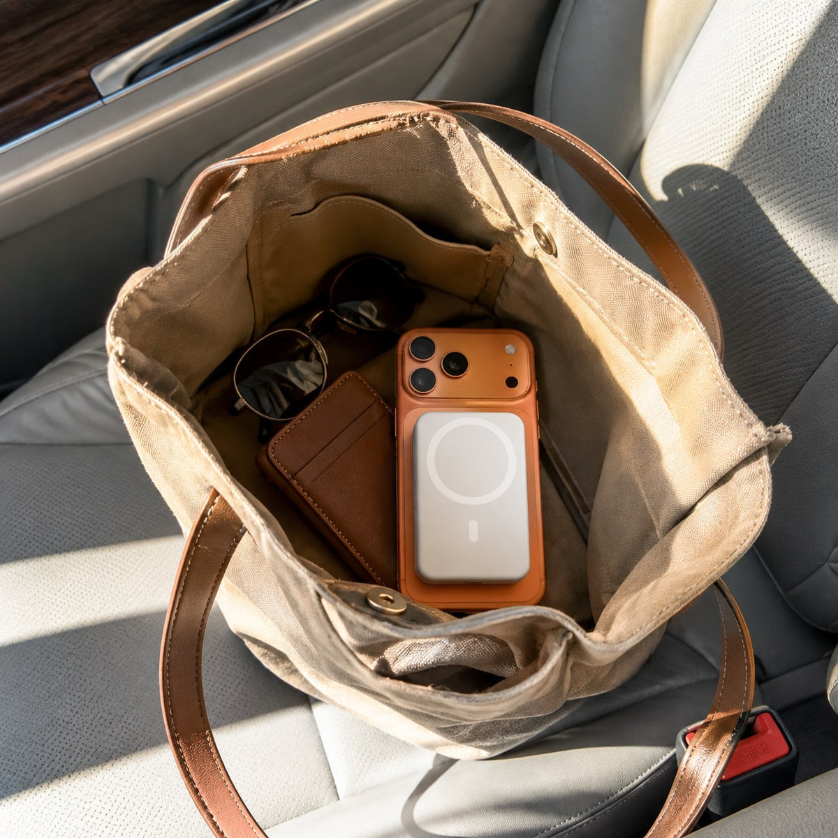 Pomence™ Magnetic Wireless Power Bank. Pomence Magnetic Wireless Power Bank in a bag on the go