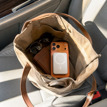 Pomence™ Magnetic Wireless Power Bank. Pomence Magnetic Wireless Power Bank in a bag on the go