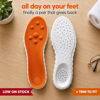 A pair of Pomence Massage Insoles, one showing the orange knit deck with its seven raised massage nodes and one showing the white cobblestone foam base