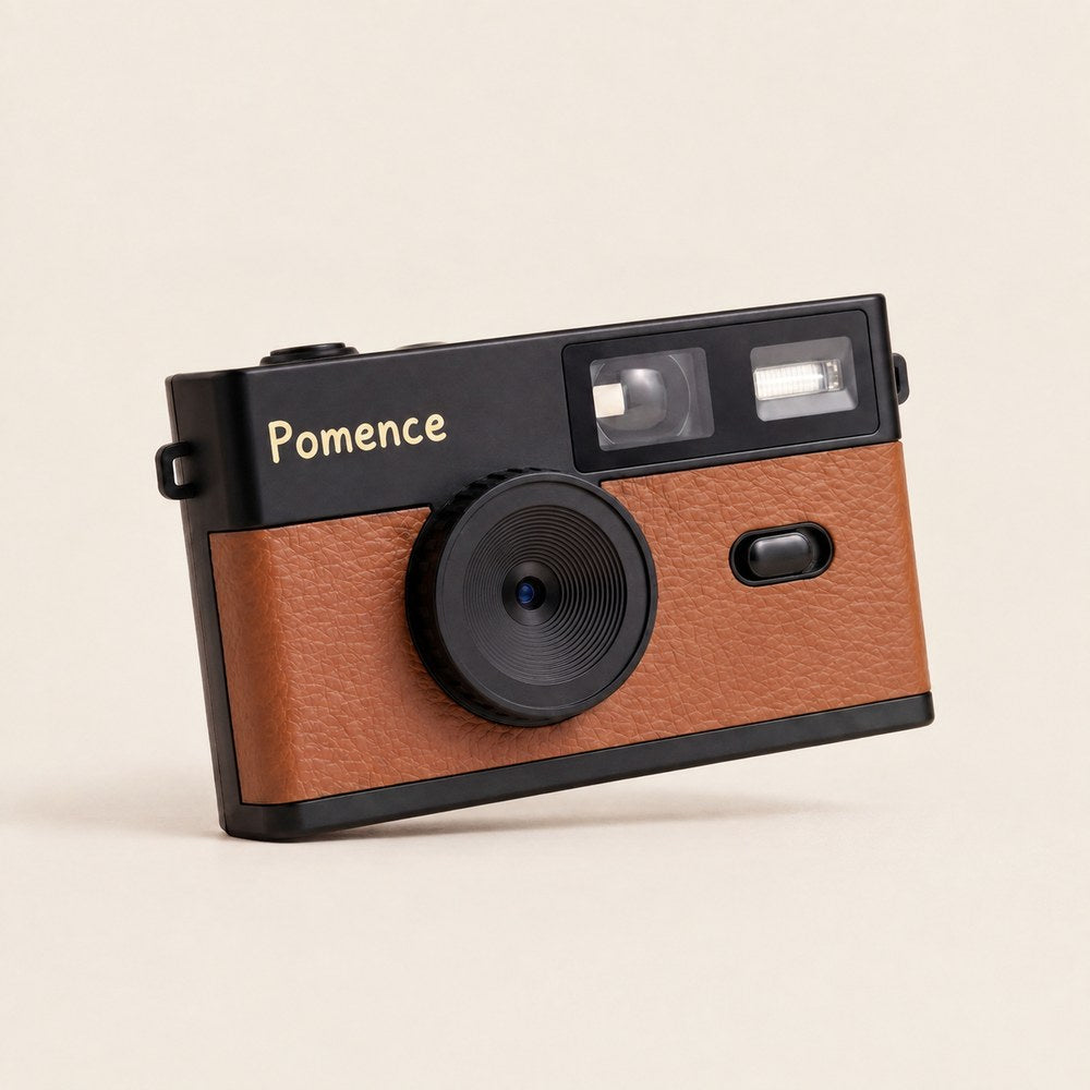 The Pomence Mini Retro Camera alone, front on, showing the lens, viewfinder and flash