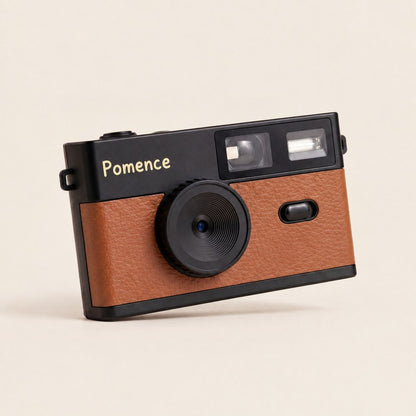 The Pomence Mini Retro Camera alone, front on, showing the lens, viewfinder and flash