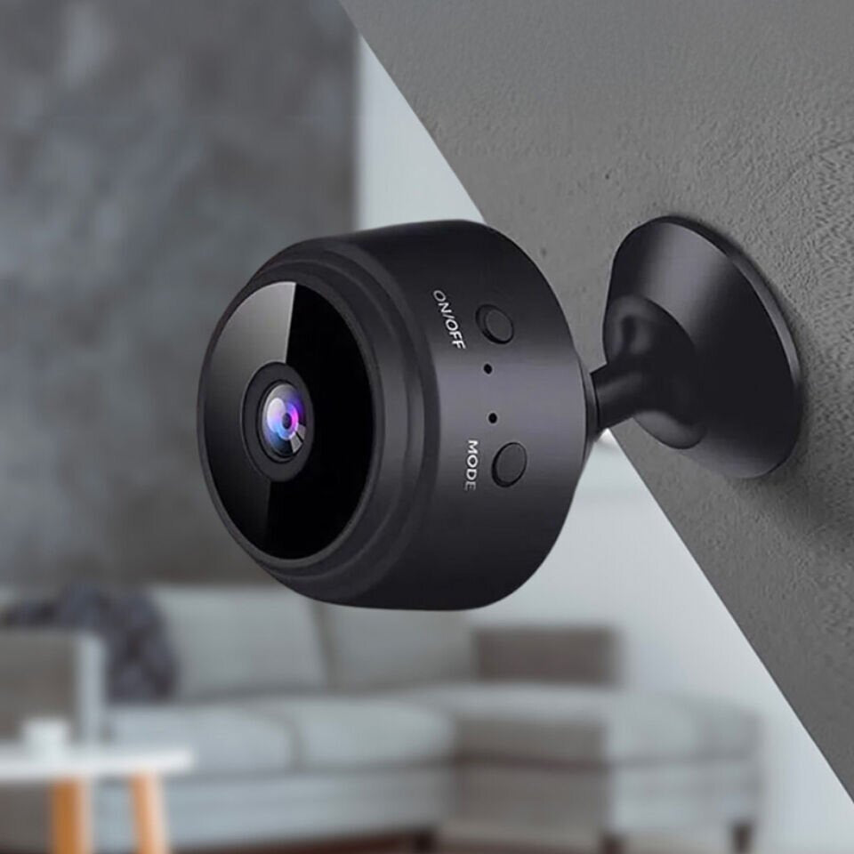 Pomence Mini WiFi Security Camera mounted in the corner of a room using its magnetic base