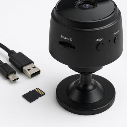 Close-up of the memory card slot and USB charging cable on the Pomence Mini WiFi Security Camera