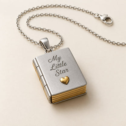 The Pomence My Little Star Book Locket Necklace alone on a plain background, closed, with the My Little Star cover engraving legible