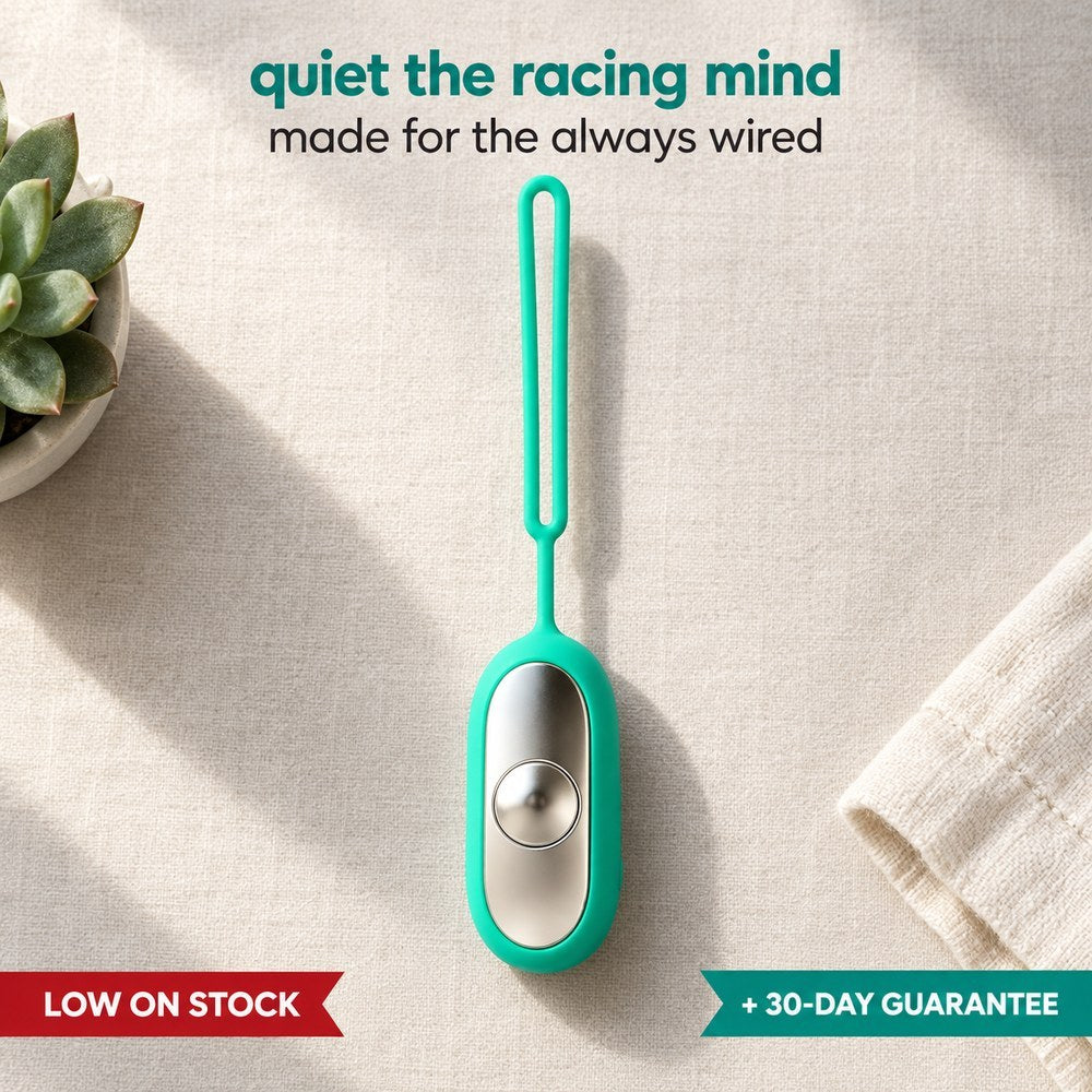 Palm Calm Fidget in Teal on pale linen: mirror polished silver metal faceplate with one domed button and the silicone loop complete