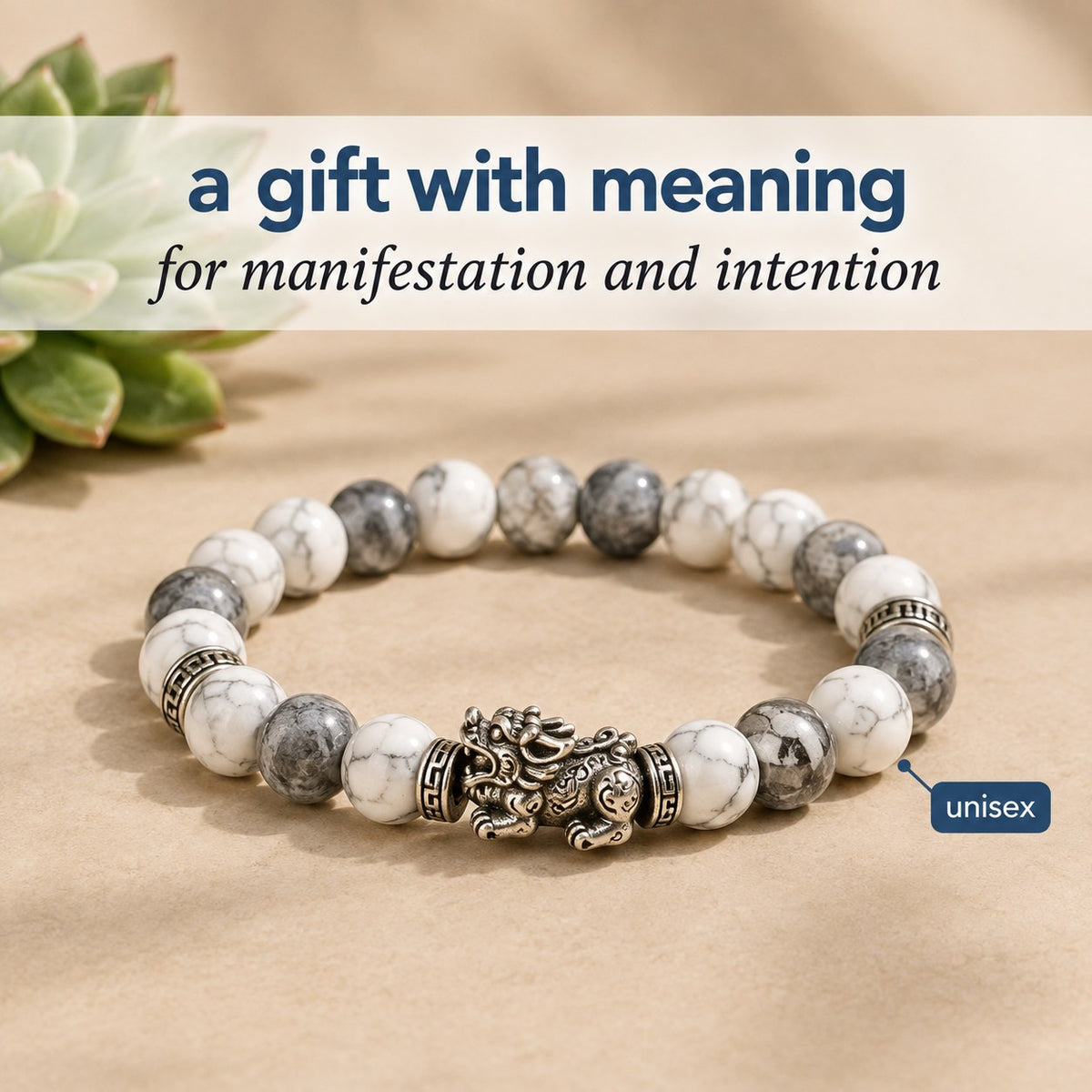 The Pomence Pixiu Wealth Bracelet staged as a gift with meaning beside a small succulent