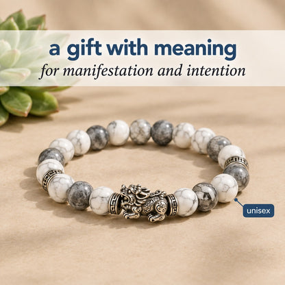 The Pomence Pixiu Wealth Bracelet staged as a gift with meaning beside a small succulent