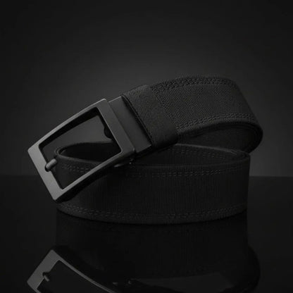 The Pomence Ratchet Tactical Belt in Black, coiled packshot showing the webbing weave and the buckle